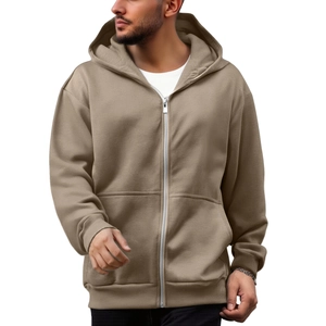 Detailed macro shot of the premium zip-up hoodie fabric texture and kangaroo pocket