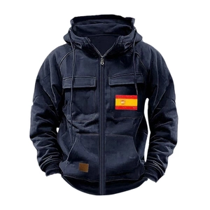 Detail of black hooded jacket with Spain flag patch and leather brand label on pocket