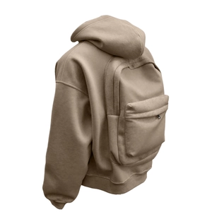 Detail of khaki oversized hoodie featuring a unique integrated backpack design with zippers