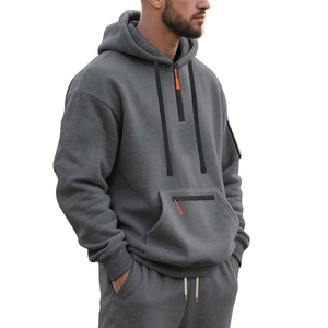 Detail view of mens heavy fleece gray hoodie showing kangaroo pocket and sleeve zip