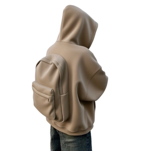 Detail of creative beige hooded sweatshirt featuring an integrated backpack design on the back