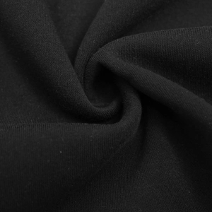 Gros plan sur la texture du tissu en tricot noir épais avec finition polaire tactique