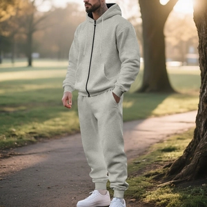 Macro shot of thick grey hooded fleece tracksuit fabric and zipper details on outdoor model