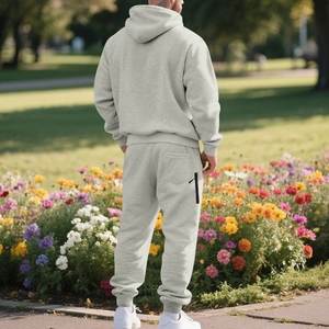 Detail view of the light grey hooded tracksuit set with a zippered back pocket feature