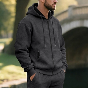 Detailed close-up of men fleece-lined charcoal grey zip-up hoodie and kangaroo pocket