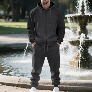 Deep grey men's heavy fleece tracksuit set with hoodie and joggers in a park setting