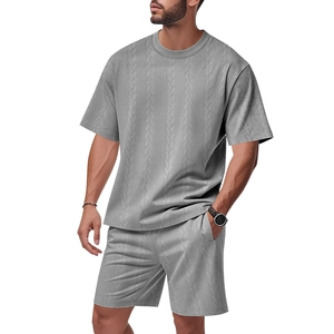 Detailed view of grey knitted men's summer set with textured jacquard cable pattern