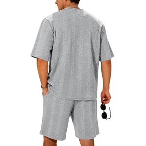 Rear view of men's grey summer knit set showing cable knit texture on top and shorts