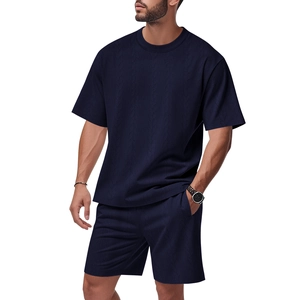 Close-up of navy blue men's set showing high-quality textured knit fabric details