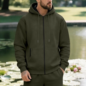 Close-up of olive green fleece-lined zip hoodie with drawstring hood and matching joggers