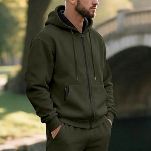 Olive green fleece-lined hooded tracksuit showing fabric texture and pocket details
