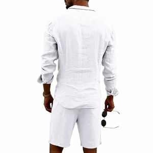 Detail view of men's white linen set back tailoring and natural fabric texture