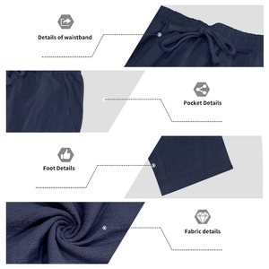 Detailed views of navy linen trousers featuring elastic drawstring waist and side pockets