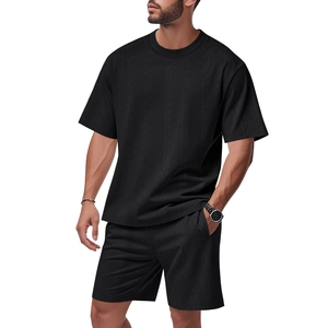 Detailed view of men's black summer set featuring premium waffle knit textured fabric
