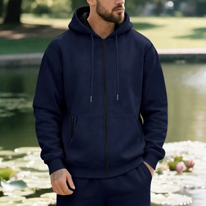 Detail of navy blue fleece hoodie set featuring drawstring hood and secure zipper pockets