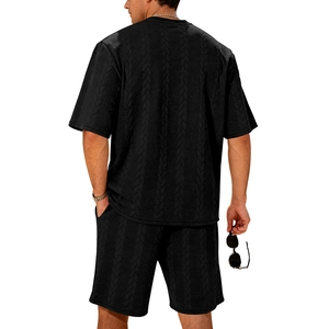 Close-up of black cable knit texture on men's summer two-piece short set from rear view