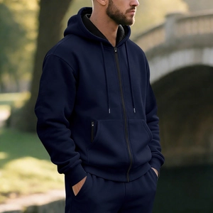 Detail of navy blue men hoodie featuring a sturdy metal zipper and cozy fleece lining