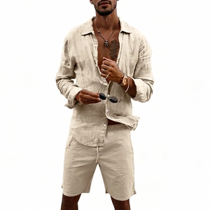 Close-up of beige men's linen shirt texture and elastic drawstring shorts with buttons