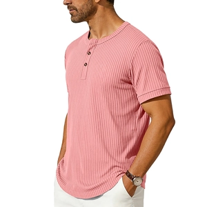 Detail of pink ribbed knit fabric on men's short sleeve Henley shirt with buttoned collar