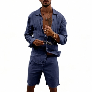 Detail of dark blue linen shirt and drawstring shorts set with natural fabric texture