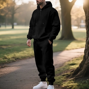 Detailed side view of men's black heavy fleece zip-up hoodie and jogger sports set