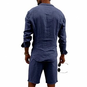 Detailed texture of navy blue men's linen long sleeve shirt and casual beach shorts set
