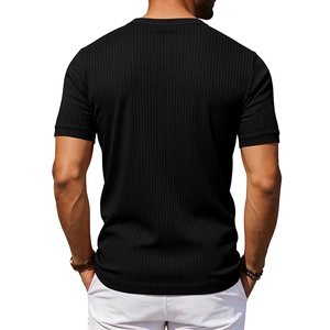 Close-up of men's black slim fit Henley shirt featuring textured vertical rib fabric back
