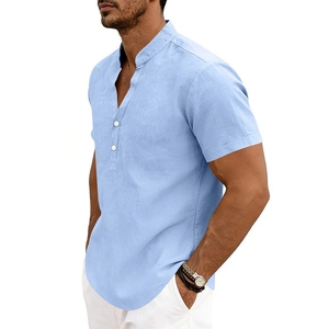 Close-up of light blue linen Henley shirt with stand collar and white buttons