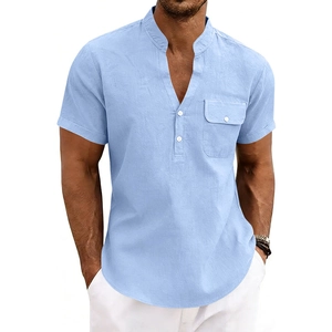 Detail of light blue linen Henley shirt featuring a V-neck and buttoned chest pocket