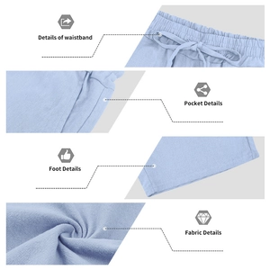 Detail view of light blue linen shorts featuring drawstring waist, pockets and fabric texture