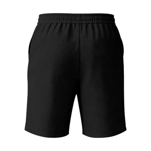 Détail du short gaufré noir pour hommes avec taille élastique et texture du tissu