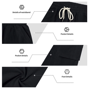 Detail of black cargo pants featuring elastic waistband with white drawstrings and pockets