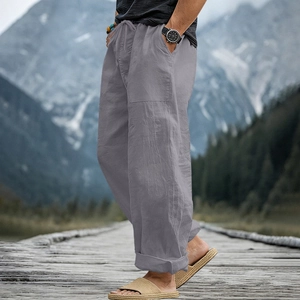 Close-up of gray linen pants with drawstring waist and breathable fabric texture
