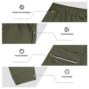 Detail view of military green cargo pants showing elastic waistband and zipper pockets