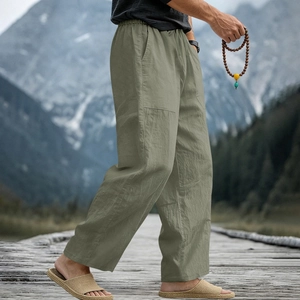 Detail of sage green men's linen pants with elastic waist and drawstring for beach
