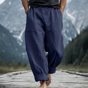 Detail of navy linen loose pants featuring drawstring waist and large patch pockets