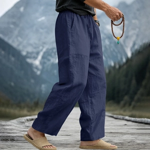 Men's loose linen trousers in navy blue featuring a drawstring waist and natural texture