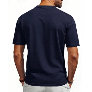 Detail view of the navy blue cotton fabric and back fit of men's casual Henley t-shirt