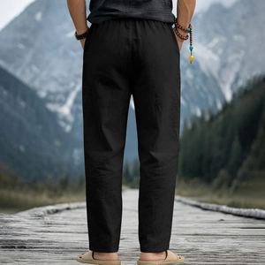 Close-up of black breathable linen blend trousers with elastic waist for casual resort wear