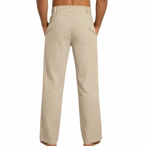 Detail of khakilinen trousers featuring a semi-elastic waistband and refined stitching