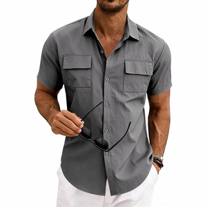 Detailed view of grey textured cargo shirt with double chest pockets and lapel collar