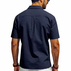 Detail view of the back pleat on navy blue men's breathable short sleeve shirt