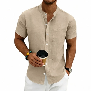 Detail shot of khaki linen shirt featuring stand collar, chest pocket and textured fabric