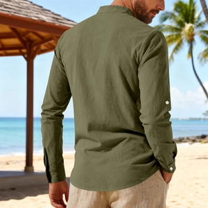 Detail view showing the curved hem and cotton linen texture of olive green men's beach shirt