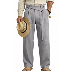 Detail of light gray linen pants featuring a unique crossover waist and matching slim belt