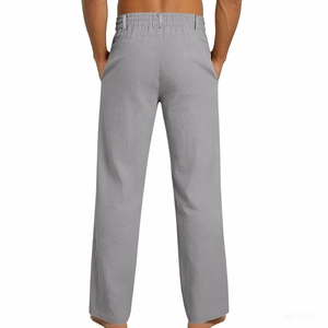 Detailed view of grey linen trousers featuring an elastic waistband and back pocket design