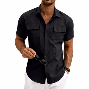 Close-up of men's black textured short sleeve shirt featuring dual utility chest pockets