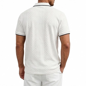 Rear view of white men's polo shirt featuring black trim and textured jacquard knit fabric