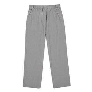 Detailed close-up of light gray linen blend pants featuring a flexible elastic waistband