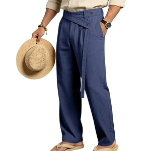 Detail of navy blue linen trousers showing unique cross-over waist design and belt